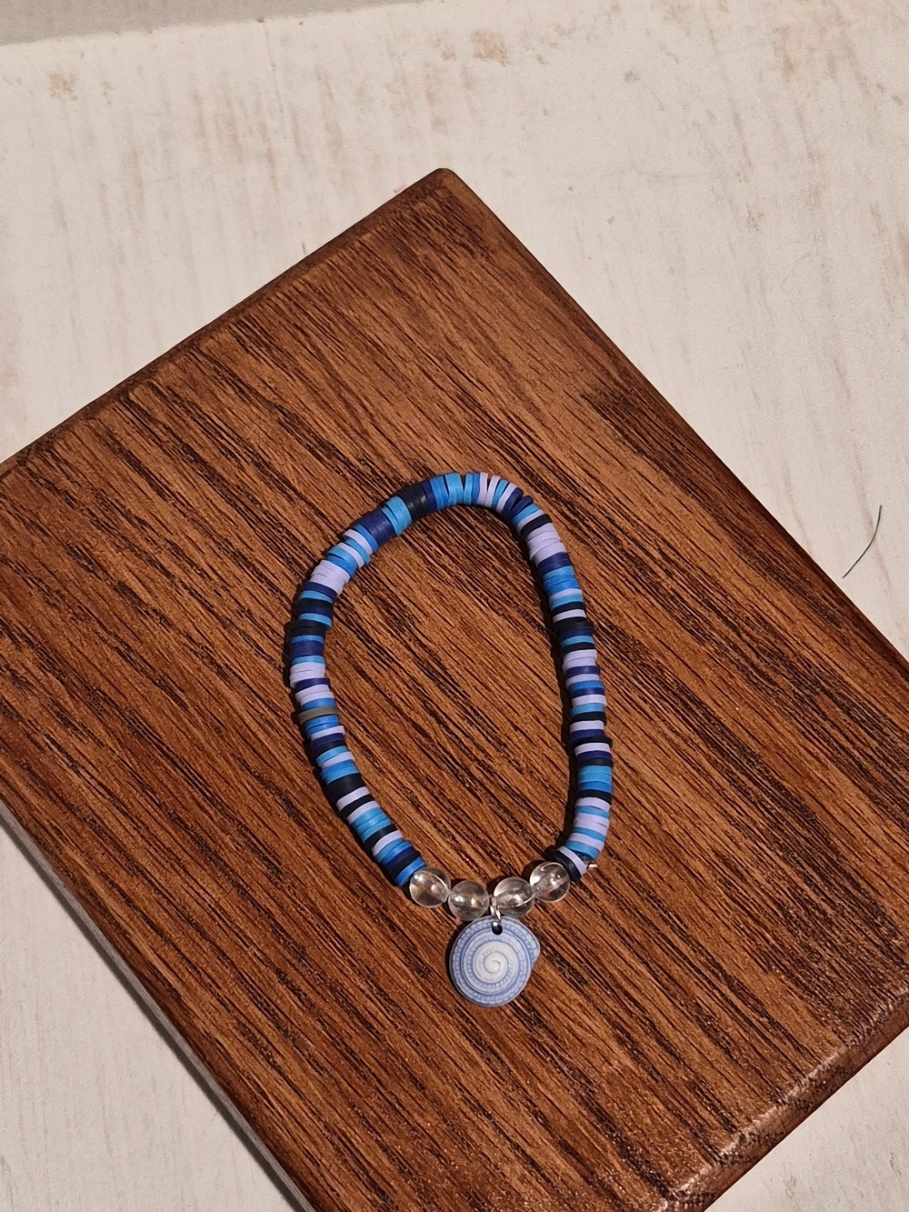 Blue Striped Bead Bracelet with Spiral Shell Charm